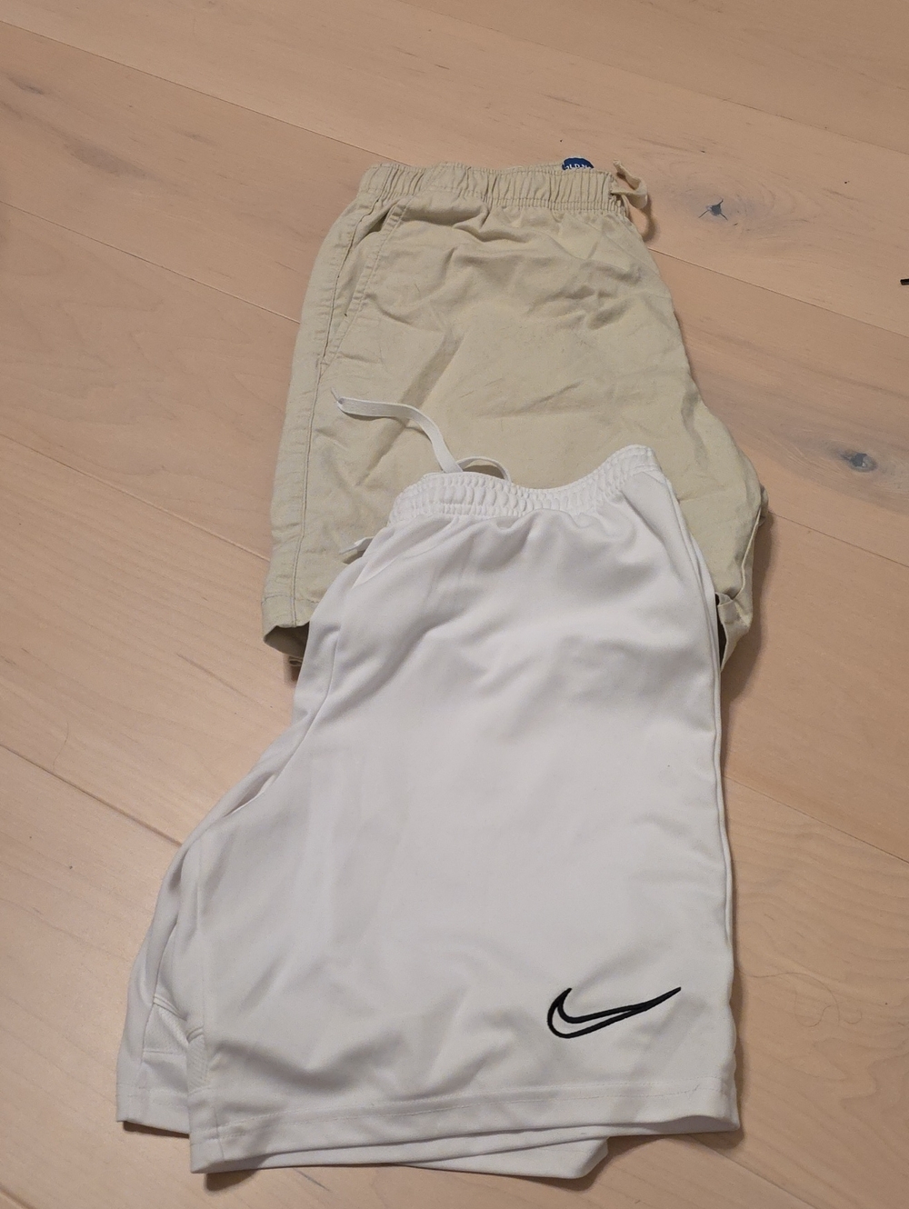 Nike White Athletic Shorts with Black Swoosh